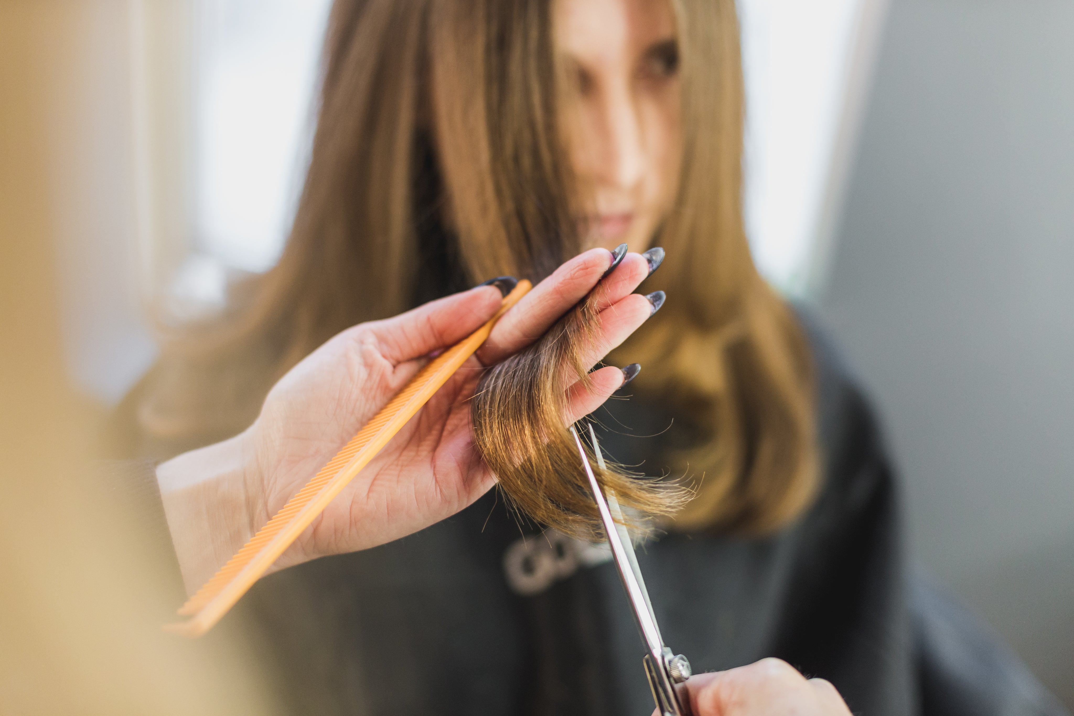 woman-getting-hair-cut-at-salon.jpg